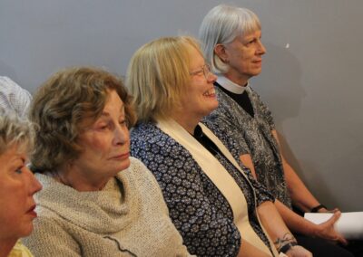 Congregation members seated, listening during the service