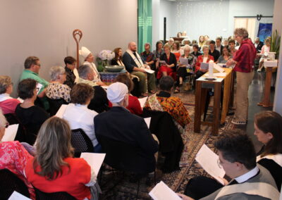 A speaker addressing the congregation from the podium